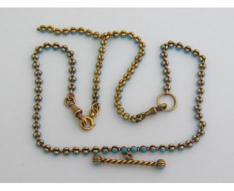 A late 19th century gold (tests 14 carat) and turquoise watch chain, in two sections, with T-bar, 48cm long, 24.9gms 