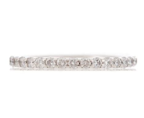 set with round brilliant cut diamonds totalling approximately 0.70 carats, in platinum, size K, 2gFull eternity.