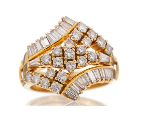 comprising removeable central diamond cluster ring within a diamond jacket, set with round and baguette cut diamonds, the dia
