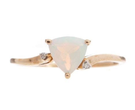 the opal flanked by diamond chips, in nine carat gold, size R 1/2, 2g