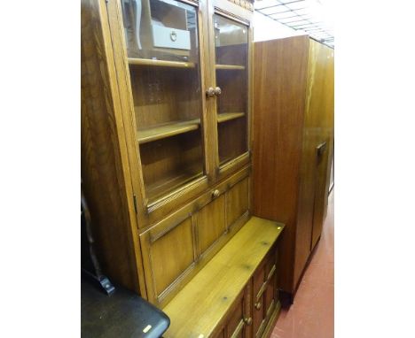 Ercol medium oak bureau bookcase with upper bevelled glazed doors over a fall front with base cupboards below