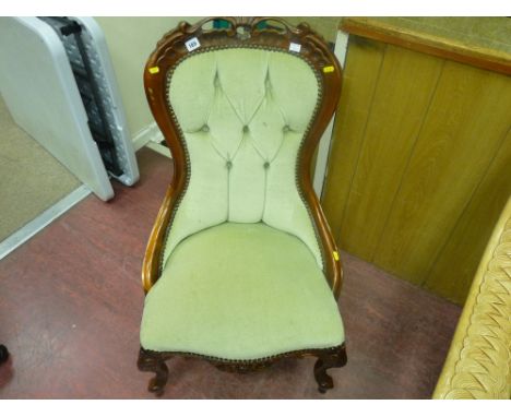 Upholstered button backed spoon chair
