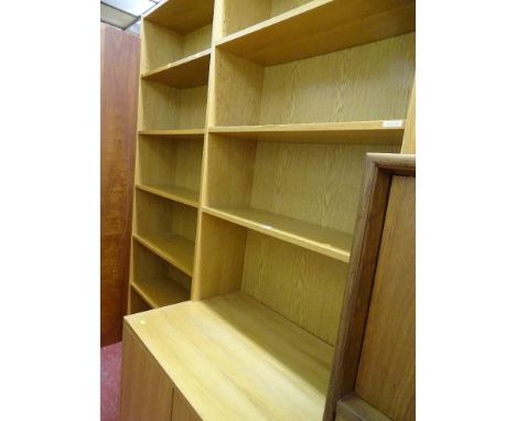 Modern light wood effect four shelf bookcase cupboard with two lower cupboard doors and a near matching six shelf bookcase (b