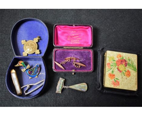 A pair of 9ct gold gentleman's cufflings;  a St Johns Ambulance fob  a silver and abalone brooch;  a compact;  etc 