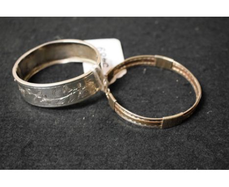 A Victorian silver bangle; another, silver