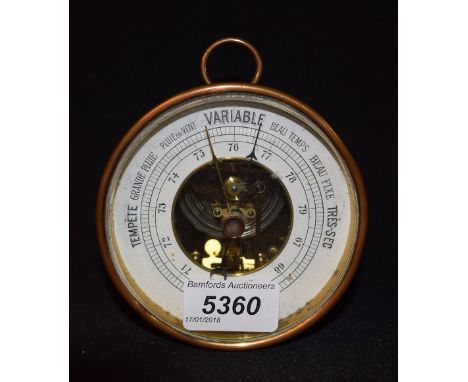 An early 20th century French copper cased desk top aneroid barometer, 