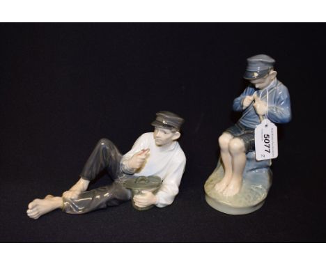 A Royal Copenhagen figure, fisher boy whittling a stick, 905; another, eating a snack 865 (2) 