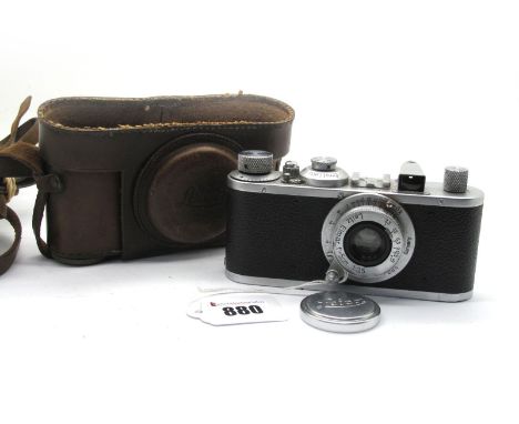 Leica by Leitz Camera, with viewfinder and Elmar f=50m 1:3,5 lens 1951 era. 35mm in distressed leather case.