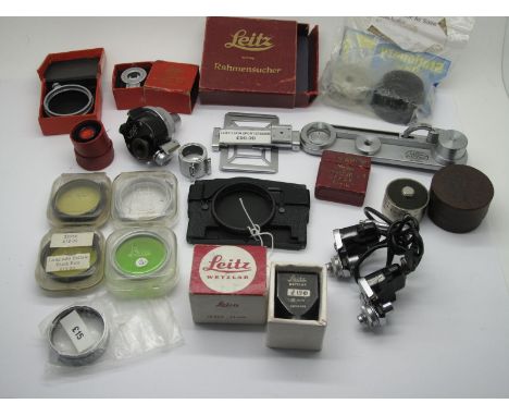 Leica Spares, some boxed, cradle screw, filters, sportsfinder Wray of London, universal finder, manual winder mechanism.