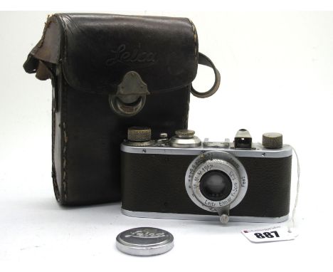 Leitz Camera No 57200, with Elmar f=8cm lens 1:3.5 brown coloured camera body, in Leica leather case.