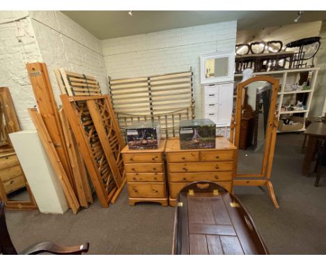 Ducal pine four piece bedroom suite comprising six and four drawer chests, cheval mirror and 5ft bedstead.