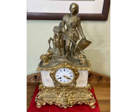 Ornate gilt metal and marble mantel clock with a Centurion mounted top, 57cm high.