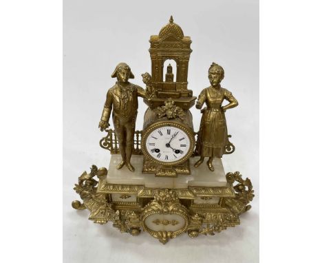 Ornate gilt metal mantel clock depicting Continental scene, 41cm high.