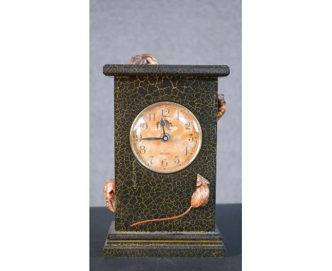 An Irish lacquered and carved mantle clock with crackle finish and with four mice running over the clock. Makers label to the