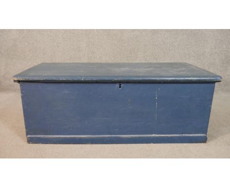 A 19th century pine travelling trunk with twin metal carrying handles, later painted. H.37 W.101 D.50cm 