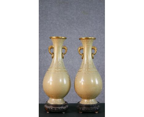 A pair of pale yellow Japanese cloisonné enamel vases with gilt metal elephant head form handles and fish scale, foliate and 