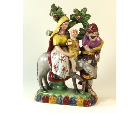 An 18th Century pearl ware figure groupDepicting the flight to Egypt, height 20cm