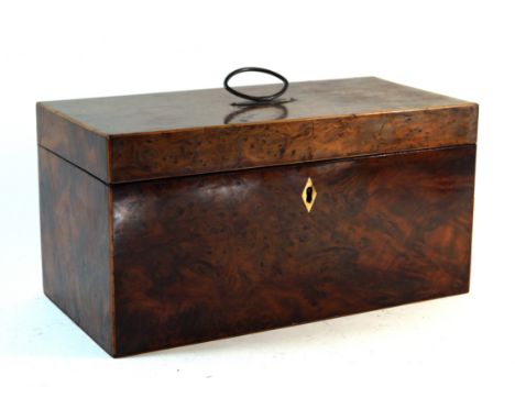 A Georgian burr walnut veneered tea caddy of rectangular formThe cover lifts to enclose a part fitted interior with two tea h