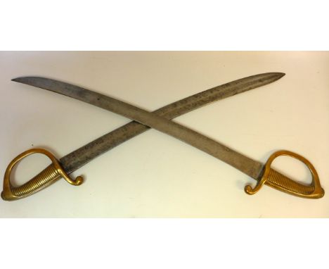 Two French infantry briquet's (short swords) early 19th CenturyThe first with single edged single fullered 54cm curved blade,