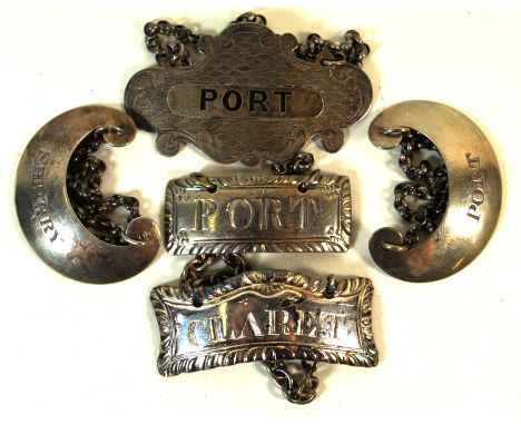 Five Victorian and later hallmarked silver decanter labelsVarious shapes and designs, to include an example having engine tur