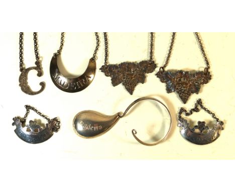 Seven George III and later hallmarked silver decanter labelsVarious designs and shapes to include a pair of Sterling silver e