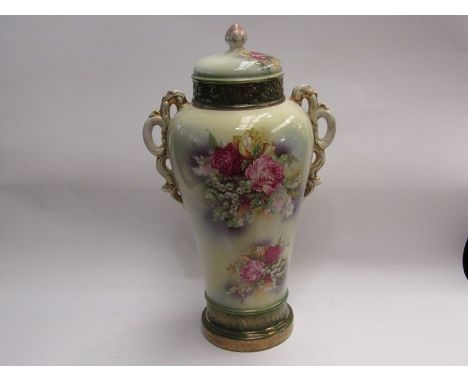 An early 20th Century ceramic lidded urn with floral spray detail, 50cm tall 