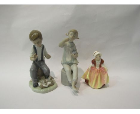 A Lladro figure of seated girl, a Nao figure of boy with puppy, and a Doulton Dinky Do figurine (3) 