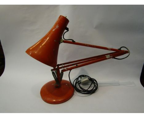 An Anglepoise lamp in orange, on circular base, a/f missing parts 