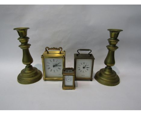 A pair of brass candlesticks, Quartz Astral carriage clock and miniature brass carriage clock, 7cm tall etc (5) 