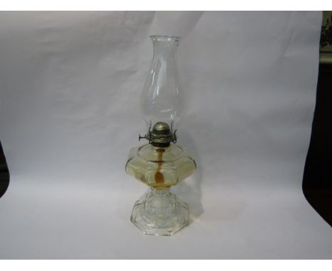 A glass oil lamp, 46cm tall 
