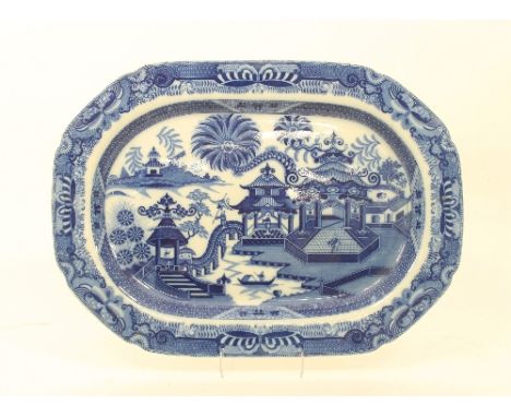 A blue and white pearlware meat dish in Curling Palm pattern, early 19th Century, 52cm wide Condition Report: Some wear under