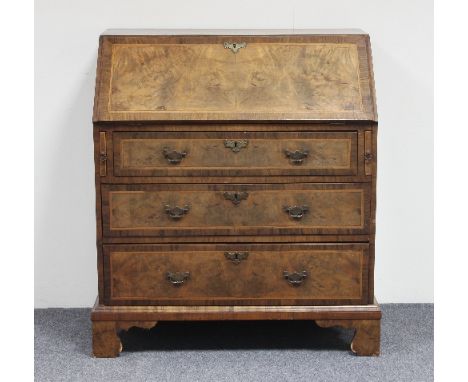 A figured walnut bureau of Queen Anne design inlaid herring bone borders, fitted beneath a fall flap and with three long draw