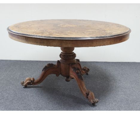 A Victorian mahogany circular breakfast table, the top with marquetry decoration of acanthus scrolls on a turned column and s