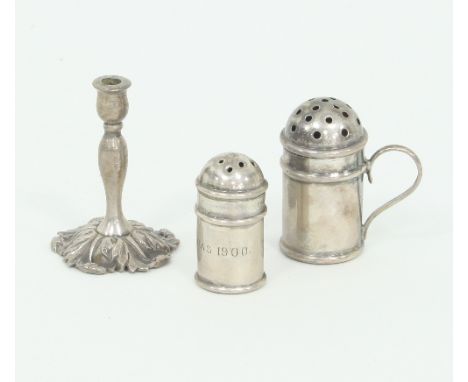A miniature or toy silver candlestick, William Comyns, London 1891, 4cm high and two miniature casters, one inscribed Xmas 19