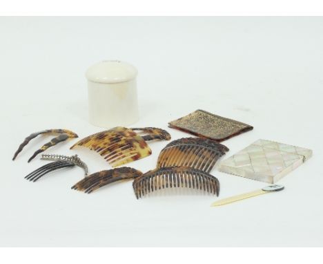 A mother-of-pearl card case, 10.5cm high, an ivory dressing table jar and cover, two tortoiseshell hair combs with paste set 