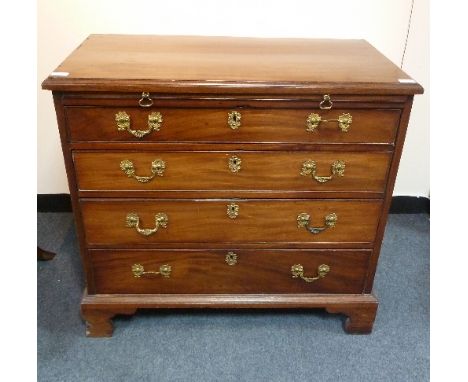 A George III mahogany chest, the top with moulded borders, fitted a brushing slide above four graduated drawers, on bracket f