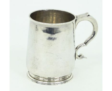 A George I silver baluster mug, maker's mark indistinct, Britannia marks for London 1721, with scroll handle, initialled bene