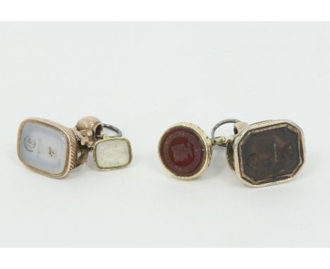 Four 19th Century fob seals, one with crest and motto 'Fiat Justitia Ruat Coelum' Condition Report: Largest seal has thinning
