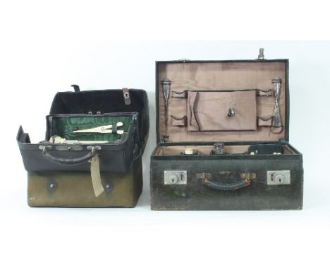 A gentleman's dressing case by W & J Milne, Edinburgh, fitted silver topped jars and ivory backed brushes, with outer canvas 