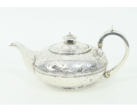A George IV silver teapot, London 1829, of compressed circular form, approximately 635gm (repaired)/Provenance: Chambers Cour