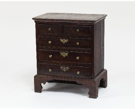 A George III mahogany apprentice chest, fitted two short over three long drawers on bracket feet, 32cm wide/see illustration 