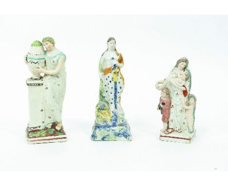 Three English pearlware figures, Plenty, a girl in mourning and a mother with children, 23cm and 18.5cm high/Provenance: Plas