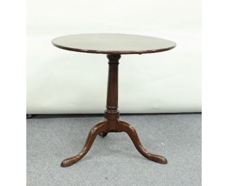 A George III mahogany supper table, the tip-up top on a column support and tripod base, 70cm diameter