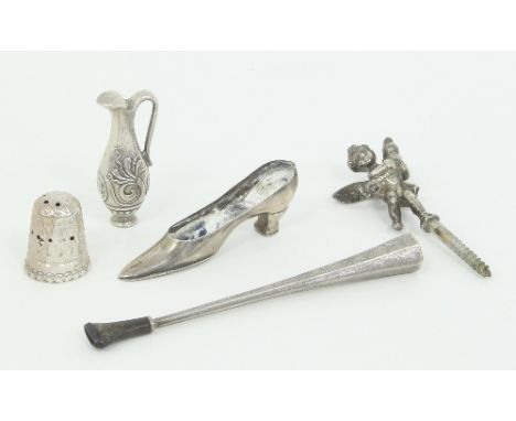 A novelty propelling pencil contained in a sterling silver case modelled as a ewer, a silver cigarette holder, a silver pin c