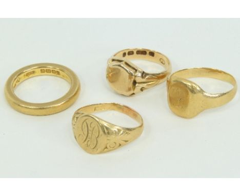 A 22ct gold wedding ring, approximately 10gm and three gold signet rings Condition Report: Wedding band - good.
Shield shaped