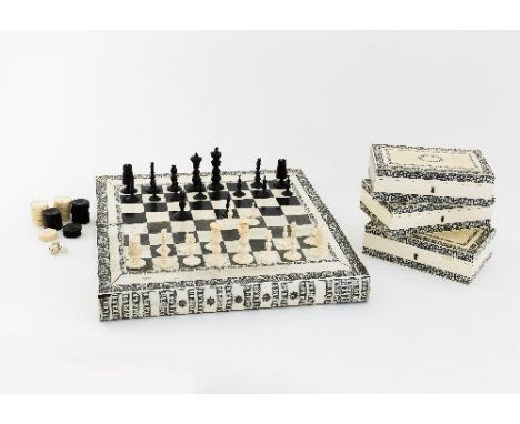 A fine Vizagapatam ivory, horn and sandalwood chess and backgammon board in the form of two books set with chequer board and 