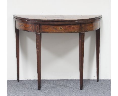 A late 18th Century half round satinwood and rosewood card table, cross banded and with marquetry decoration, the hinged top 