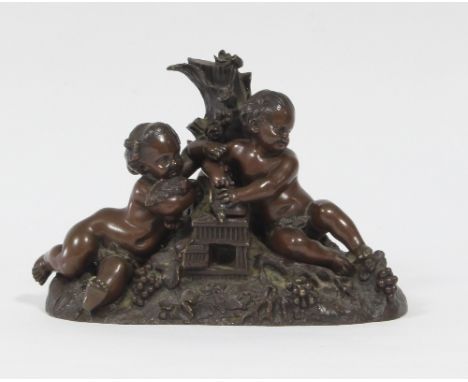 A 19th Century French bronze group of two putti with doves in a cage, 20cm wide