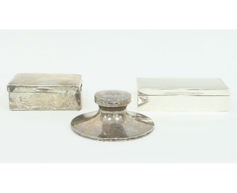 A silver cigarette box, Birmingham 1946, with engine turned cover, 18cm wide, another cigarette box and a capstan inkwell wit
