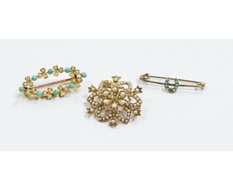An Edwardian 15ct gold seed pearl brooch/pendant, a turquoise and half pearl oval wreath brooch and a turquoise and half pear